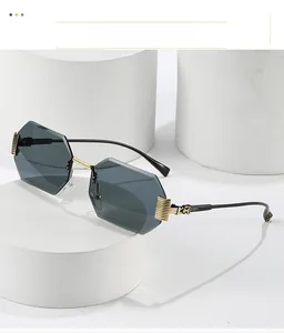 Detailed macro view of rimless octagonal sunglasses with decorative gold metal wire temples