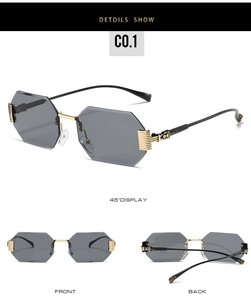 Detail view of octagon rimless sunglasses with gold engraved vintage temple patterns