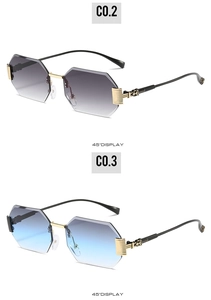 Detail of rimless octagonal sunglasses with gradient lenses and textured gold temples