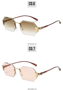 Detail of rimless octagonal sunglasses with gradient lenses and engraved gold metal temples
