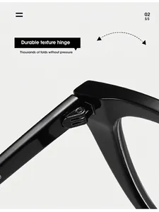Close-up of durable metal hinge on black cat-eye frames showing high-quality construction