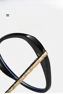 Macro view of butterfly glasses frame featuring gold metal hinges and black TR90 material