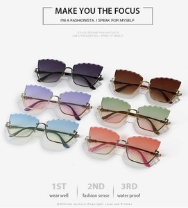 Detail of gradient cat eye sunglasses with scalloped edges and metal frames in 6 colors