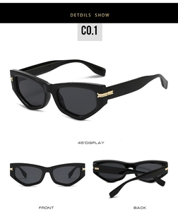 Détails des lunettes de soleil œil-de-chat noires avec accents dorés sur les branches