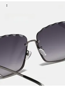 Detail of comfortable silicone nose pads on rimless cat-eye sunglasses with metal frame