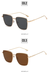 Detail view of square metal sunglasses with dark gray and brown lenses at 45 degree angle