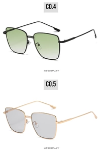 Detailed 45-degree view of square metal sunglasses with green and grey gradient lenses