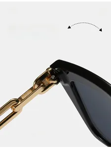 Close-up of durable metal hinge and stylish gold chain temple on black square sunglasses