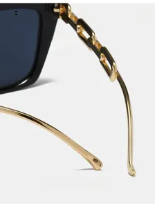 Detail of square sunglasses with black and gold chain temple design and curved tips