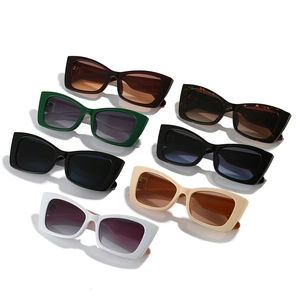 Set of seven trendy cat eye sunglasses in various colors including tortoiseshell and green