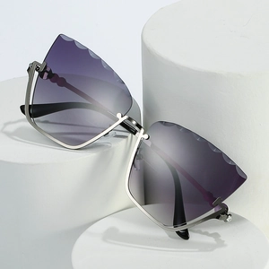 Cat eye rimless sunglasses with purple gradient lenses and silver metal frame