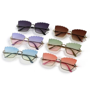 Trend cat-eye rimless sunglasses with wave-cut lenses and rhinestone metal frame set