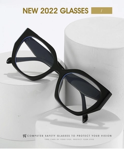 Modern cat-eye computer safety glasses with blue light coating on white pedestal