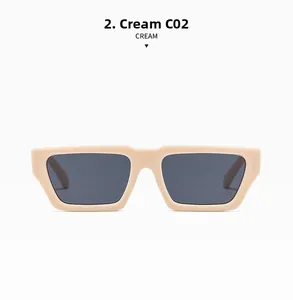 Detailansicht der cremefarbenen Rechteck-Sonnenbrille mit dickem Rahmen und grauen Gläsern