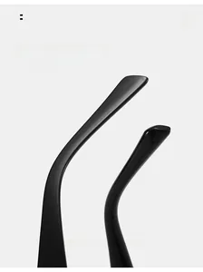 Detailed macro view of ergonomic curved temple tips on black cat-eye eyeglass frames