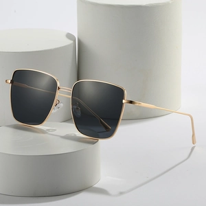 Fashionable square metal frame sunglasses with gold finish and dark black lenses for women