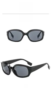 Front and side view of black futuristic oval sports sunglasses with wide temples