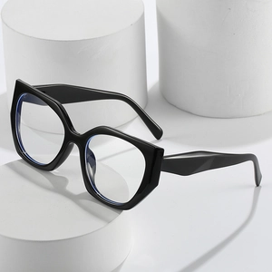 Chic black cat-eye geometric glasses frames on white minimalist display stands