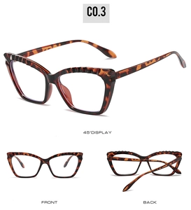 Detail view of cat eye glasses frame with tortoiseshell pattern and ribbed textures