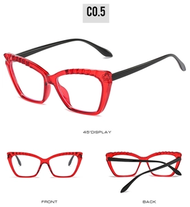 Detail views of red cat-eye glasses frame with black temples and 3D textured rim