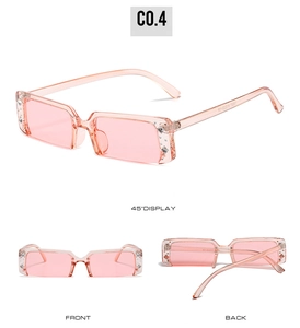 Detail view of pink rectangular semi-rimless sunglasses with rhinestone accents