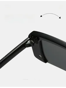 Detail shot of durable metal hinge on black half-frame sunglasses with diamond accents
