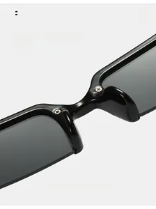 Detailed close-up of integrated nose pads on black semi-rimless diamond sunglasses