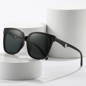 Classic oversized square sunglasses with black frame, grey lenses and silver ring detail