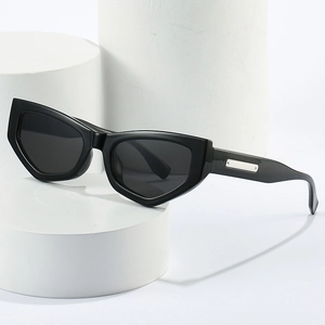 Trendy cat eye sunglasses in glossy black with polar lenses and silver metal temple accents