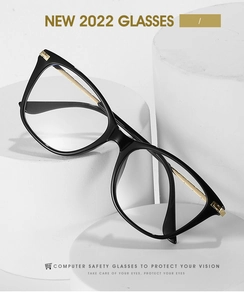 Détail de lunettes anti-lumière bleue œil de chat avec branches dorées en métal