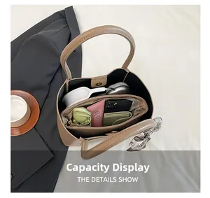 Spacious interior of khaki pebble leather tote bag showing large capacity for essentials