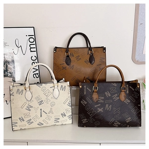 Three fashion tote bags in cream, tan, and dark brown with MYXXING letter patterns