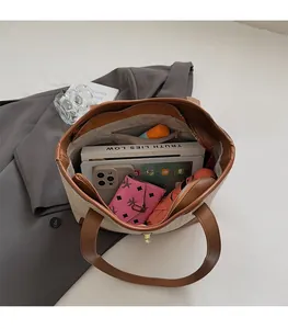 Detailed top view of a large tote bag interior showing spacious storage and inner pocket