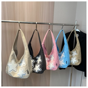 Selection of colorful canvas hobo bags with stylish plush star patches in five various shades