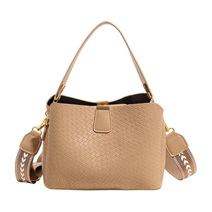 Fashionable khaki woven bucket bag with wide patterned strap and golden metal lock