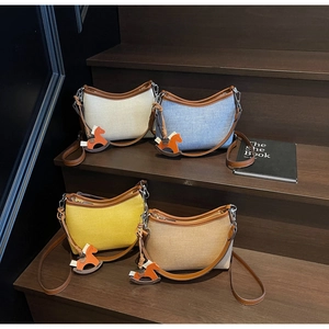 Detailed set of canvas shoulder bags in four colors with leather trim and horse charms