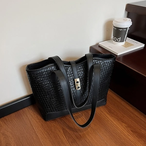 Chic black woven leather tote bag with gold twist lock and long shoulder straps