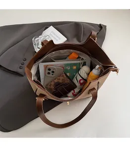 Top view of spacious striped tote bag interior showing organized daily essentials