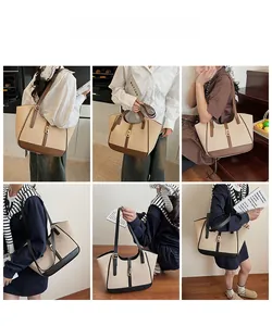 Detail of woven tote bag with contrast leather trim and elegant golden metal lock clasp