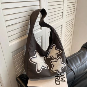 Brown canvas hobo bag for women with white plush star patches and minimalist casual design
