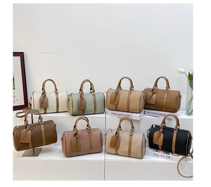 Multiple colors of lychee grain faux leather bowling bags displayed on white steps