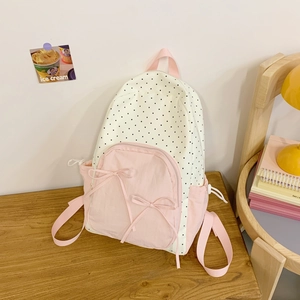Sweet polka dot backpack with pink bows and drawstring side pockets for students