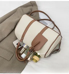 Detail shot showing internal capacity of the retro bowling bag with daily essentials