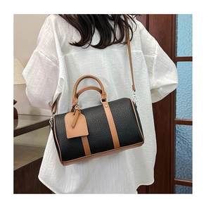 Modern Boston handbag in black pebbled leather with brown contrast details and strap