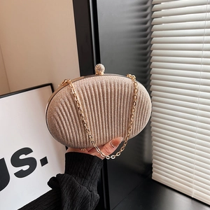 Elegant champagne pleated evening clutch bag with rhinestone clasp and gold chain strap