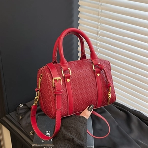 Elegant red woven leather Boston handbag with gold hardware and adjustable crossbody strap