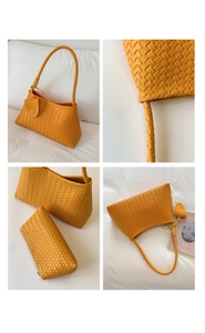 Detail of yellow woven texture and matching pendant on a stylish women's shoulder bag