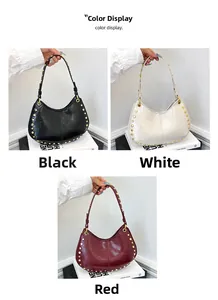 Close-up of hobo bags in black, white and red colors with gold rivet details