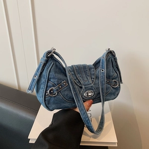 Vintage Y2K light blue denim underarm bag with silver studs and adjustable shoulder strap