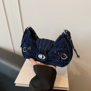 Retro deep blue denim hobo shoulder bag with silver buckles and distressed frayed edges